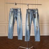 ERD mud-dyed knife cut a hole in the blue jeans