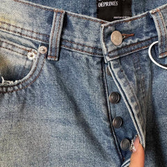 ERD mud-dyed knife cut a hole in the blue jeans