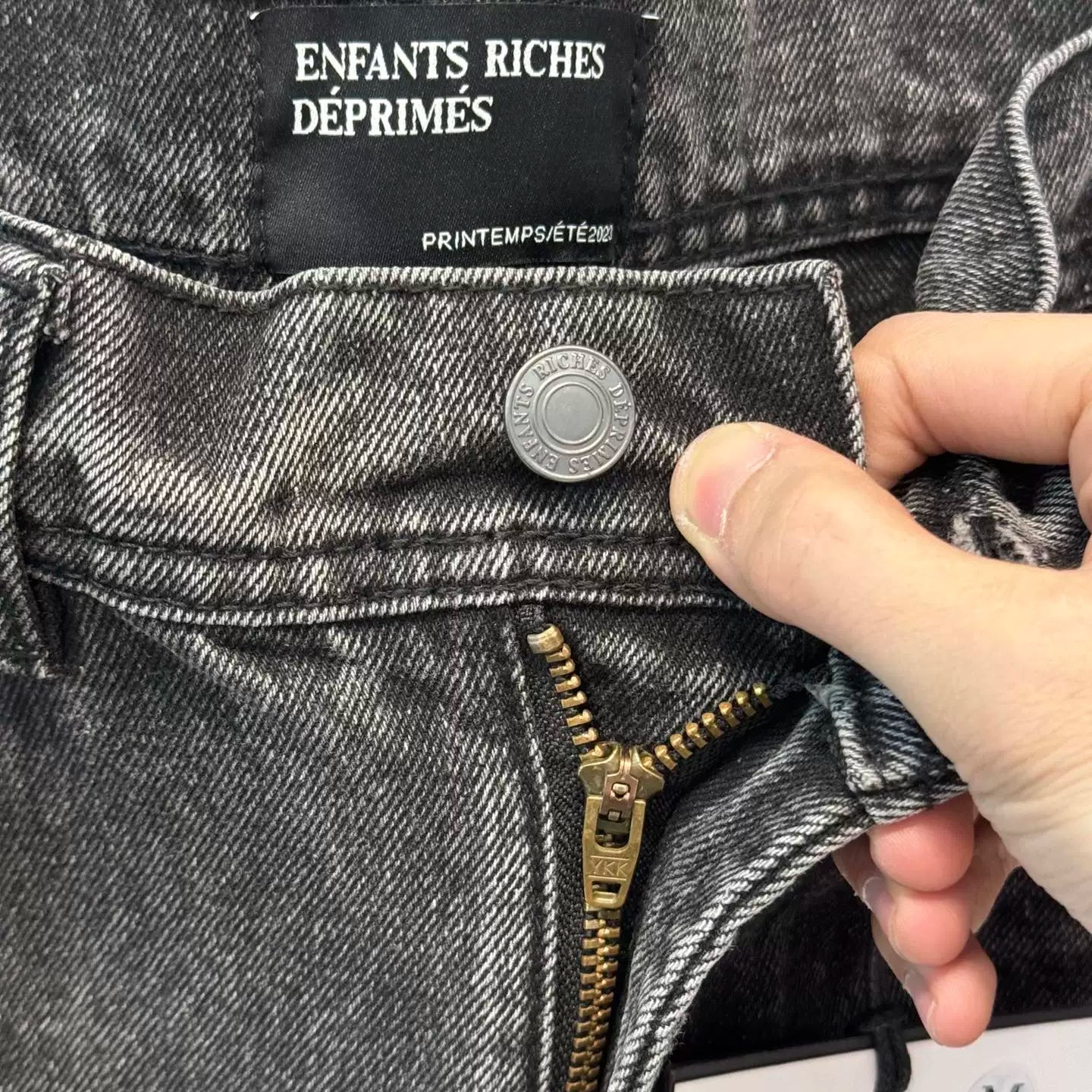ERD washed denim jeans with distressed and patched holes
