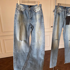 ERD mud-dyed knife cut a hole in the blue jeans