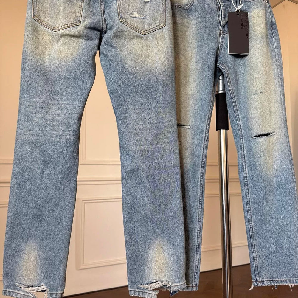 ERD mud-dyed knife cut a hole in the blue jeans